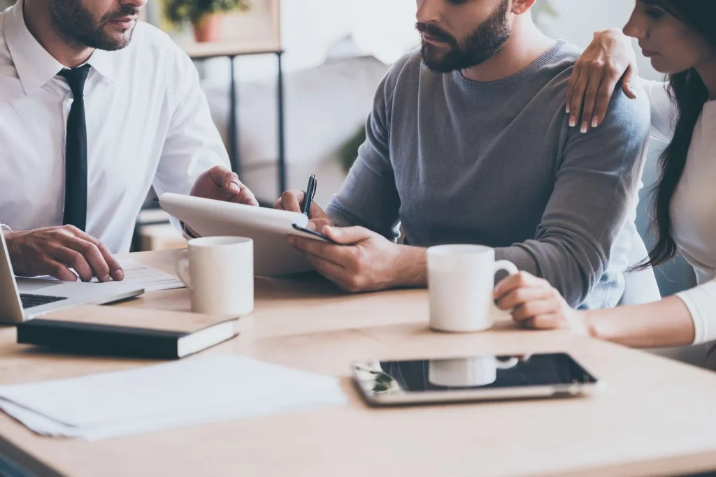 Men signing document - New Spirit Detox Center